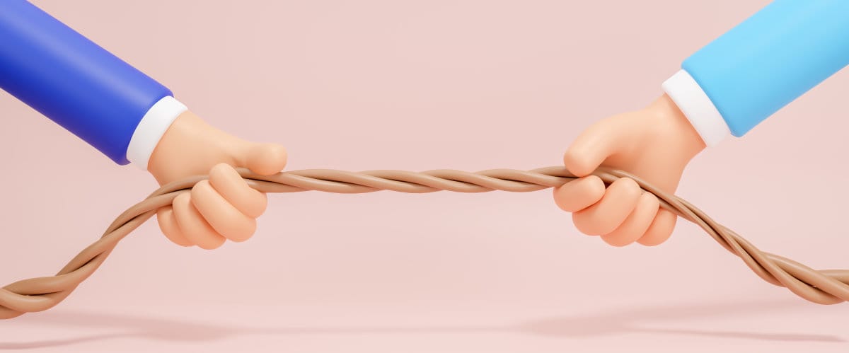 Two hands holding a rope indicating a tie